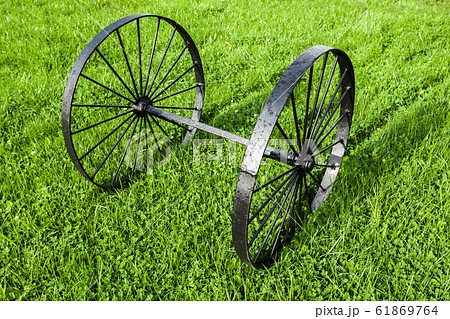 Vintage black metal wheels on one axis Vintage black metal wheels on one axis 61869764