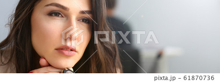 Beautiful smiling girl at workplace look in camera Beautiful smiling girl at workplace look in camera 61870736