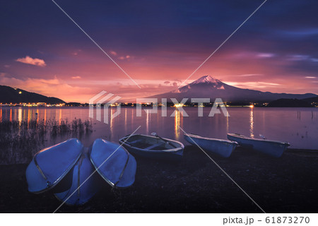 Mt. Fuji over Lake Kawaguchiko with boats at 61873270