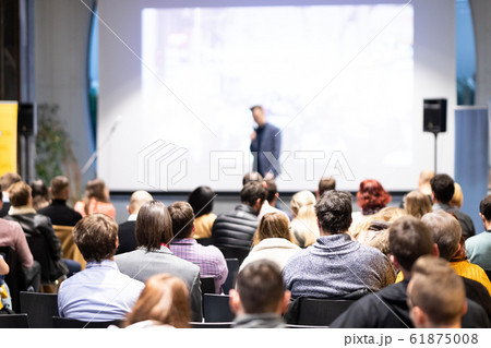 Business speaker giving a talk at business conference event. 61875008