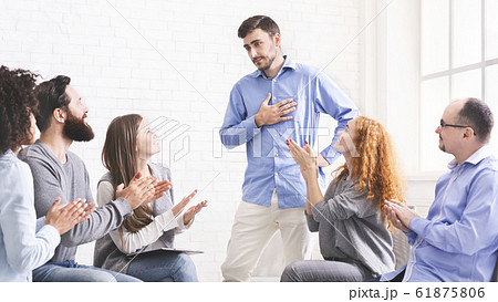 Young man appreciating support at group therapy session in rehab Young man appreciating support at group therapy session in rehab 61875806