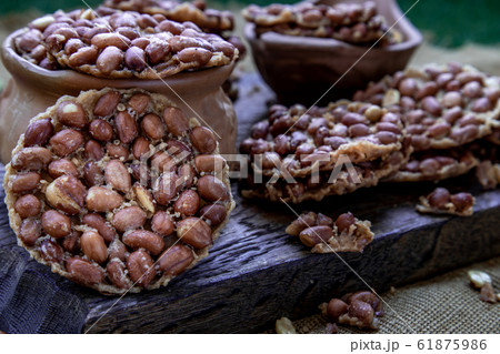 Close-up of Peanut crackers made from nuts and Close-up of Peanut crackers made from nuts and 61875986