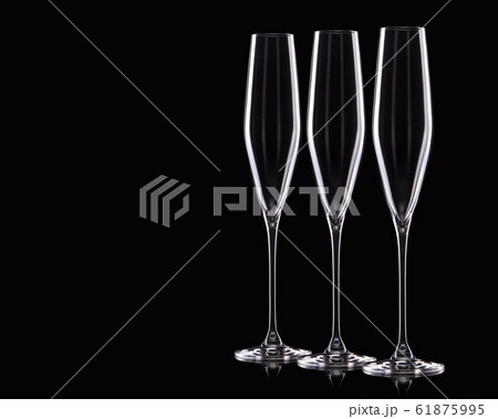 Set of empty luxury champagne glasses in a row isolated on a black background 61875995