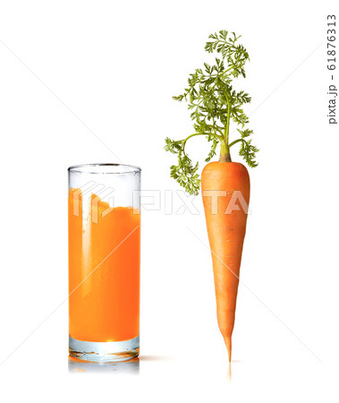 Juice glass with fresh organic carrot vegetable. 61876313
