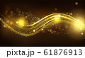 Gold sparkle wave on black blurred background. 61876913