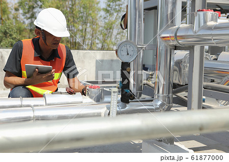 The system engineer is checking the pressure and 61877000