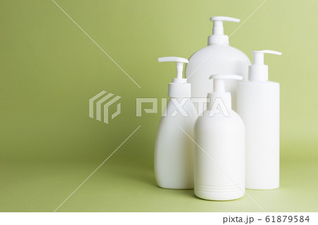 White plastic soap dispensers. Copy space. Place for text. 61879584