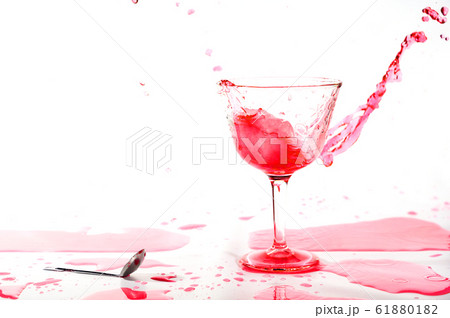 Red alcohol cocktail drink splash on white background. Red alcohol cocktail drink splash on white background. 61880182