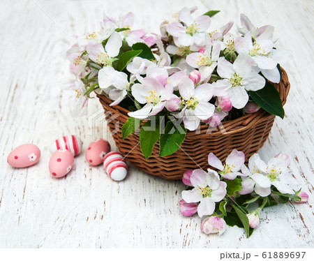 Basket with blossom and easter eggs 61889697