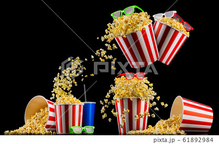 Set of striped buckets with popcorn, cup of drink and glasses isolated on black 61892984
