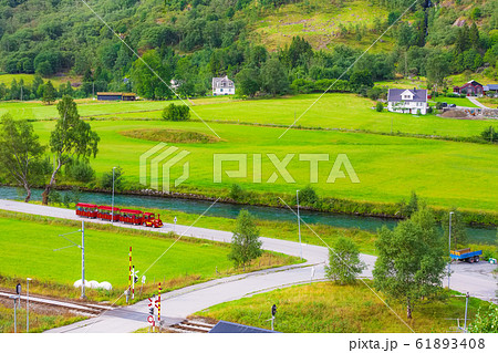 Flam, Norway red train tour in green valley Flam, Norway red train tour in green valley 61893408