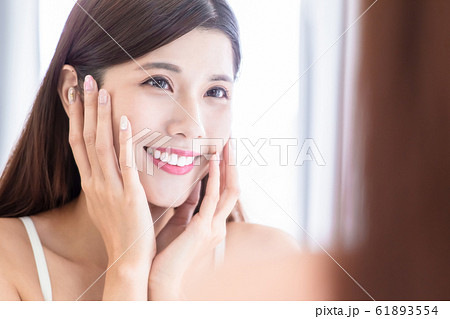 skin care girl touch face 61893554