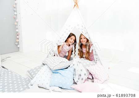 Girls having fun tipi house. Girlish leisure. Girls having fun tipi house. Girlish leisure. 61893708