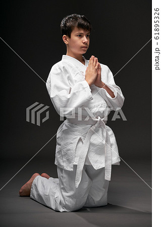 sport concept - greeting bow, a teenager dressed sport concept - greeting bow, a teenager dressed 61895326