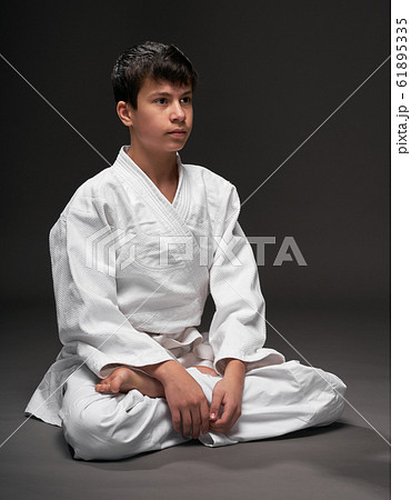 portrait of a teenager dressed in martial arts 61895335