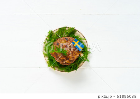 Traditional Swedish dish beef Lindstrom. In the plate with dill. Swedish flag.  Swedish cuisine. Scandinavian 61896038