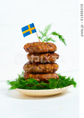 Traditional Swedish dish beef Lindstrom. In the plate with dill. Swedish flag. Swedish cuisine. Scandinavian Traditional Swedish dish beef Lindstrom. In the plate with dill. Swedish flag. Swedish cuisine. Scandinavian 61896039