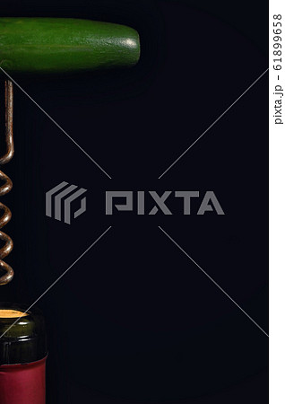 Wine Bottle And Corkscrew Isolated On Black Wine Bottle And Corkscrew Isolated On Black 61899658