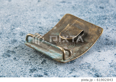 Old brass belt buckle with a star Old brass belt buckle with a star 61902843