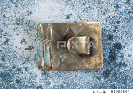 Old brass belt buckle with a star 61902844