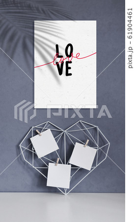 Graceful openwork heart with notes on a concrete wall background. Minimalism. Concept Symbol of love and Valentine's Day. Home Decor Graceful openwork heart with notes on a concrete wall background. Minimalism. Concept Symbol of love and Valentine's Day. Home Decor 61904461