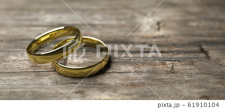 gold wedding rings on wooden table soft focus macro shot 3d render illustration gold wedding rings on wooden table soft focus macro shot 3d render illustration 61910104