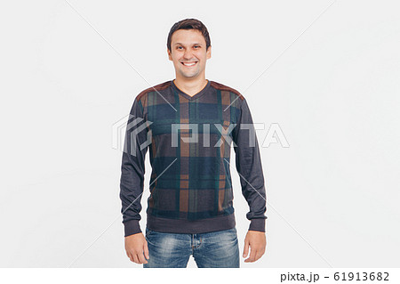 the concept of advertising clothes, fashion show-men's hoodies, shirts on a white background. Ornament and colors, decorative elements: stripes, locks, patches. Copy space the concept of advertising clothes, fashion show-men's hoodies, shirts on a white background. Ornament and colors, decorative elements: stripes, locks, patches. Copy space 61913682