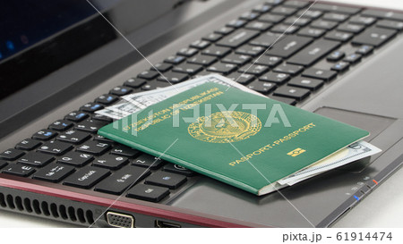 Passport of Uzbekistan on the keyboard 61914474