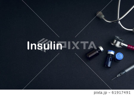 Stethoscope, Vial, and Syringe with words INSULIN 61917491