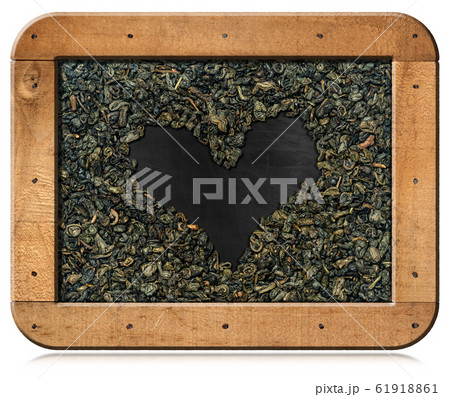 Dried Leaves of Green Gunpowder Tea arranged in a heart shape 61918861