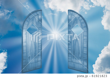 Sun shining on sky through open door Sun shining on sky through open door 61921823