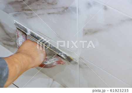 Grouting ceramic tiles process of filling the Grouting ceramic tiles process of filling the 61923235