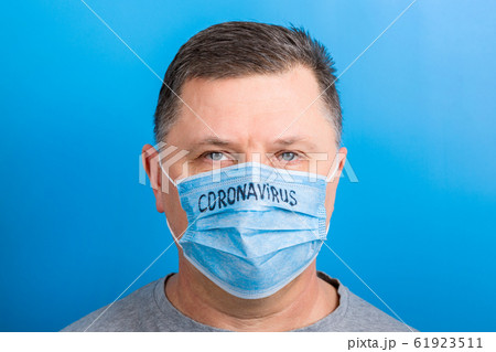 Portrait of a sick man wearing medical mask with Portrait of a sick man wearing medical mask with 61923511