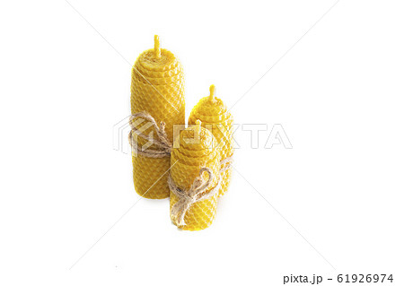 a group of wax candles tied with a rope. Natural 61926974
