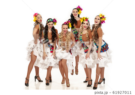 Beautiful young women in carnival and masquerade costumes on white studio background 61927011