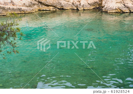Beautiful landscape with turquoise water surface and rocky cliffs in Calanques National Park. 61928524