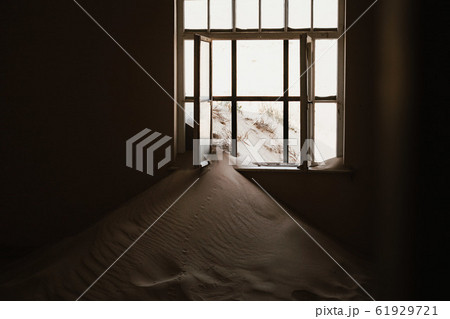 desert sand has invaded and taken over these rooms in Kolmanskoppe, Namibia 61929721