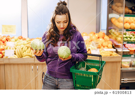 Beautiful woman in a supermarket 61930813