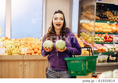 Beautiful woman in a supermarket 61930814