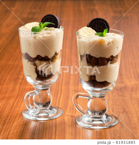 Sweet dessert with biscuit crumble, banana and Sweet dessert with biscuit crumble, banana and 61931885