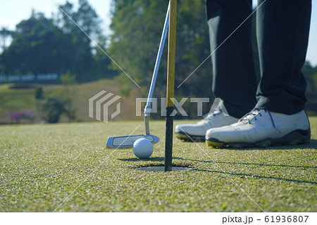 Golfer playing golf in beautiful golf course in Golfer playing golf in beautiful golf course in 61936807