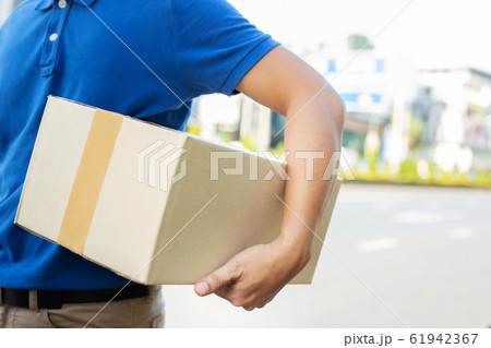 parcel delivery man of a package parcel delivery man of a package 61942367