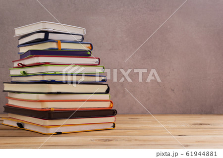 notepad or paper notebook at wooden table 61944881