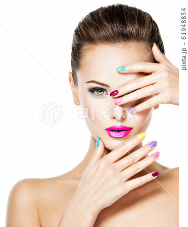 Beautiful woman with colored nails and pink lips Beautiful woman with colored nails and pink lips 61948854