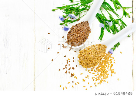 Flaxen white and brown in two spoons on board top 61949439