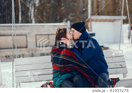 couple in a winter couple in a winter 61955278