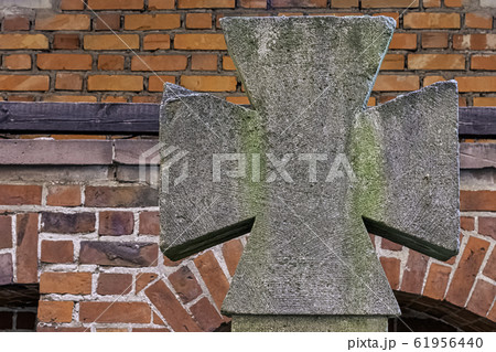 Old Maltese cross at Castle of the Teutonic Order in Malbork, Pomerania, Poland 61956440