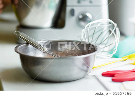 Woman professional pastry chef prepares chocolate Woman professional pastry chef prepares chocolate 61957569