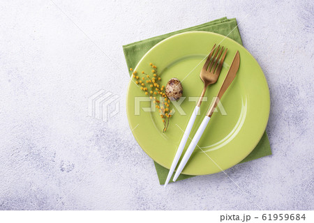 Easter table setting with green plate Easter table setting with green plate 61959684