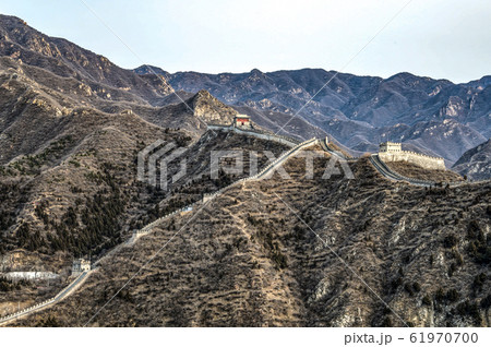 Buildings of a fragment of the Great Chinese Wall in the mountains near Bejing Buildings of a fragment of the Great Chinese Wall in the mountains near Bejing 61970700